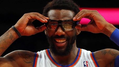 Amar'e Stoudemire adjusts his goggles during a game