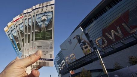 Super Bowl XLV tickets are held outside Cowboys