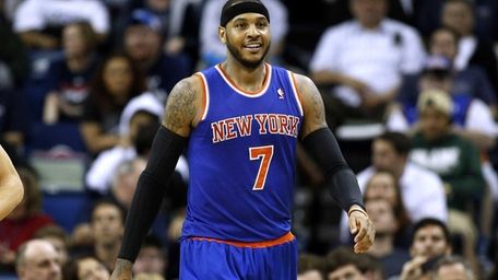 Knicks small forward Carmelo Anthony smiles after scoring