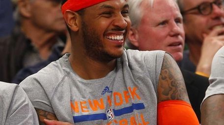 Carmelo Anthony has a laugh on the bench