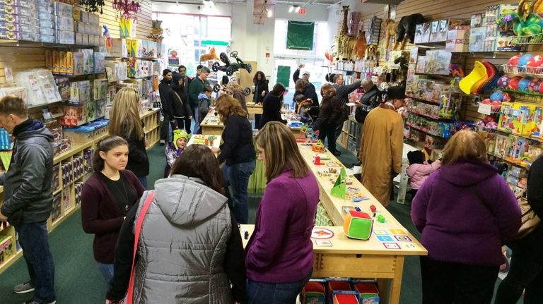 Holiday shoppers at Lainie's Way toy store in