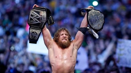 Daniel Bryan celebrates winning his second match