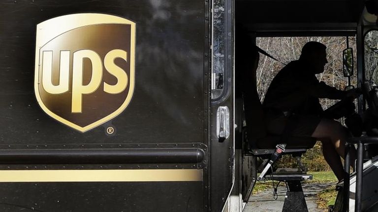 A UPS driver drives after a delivery in