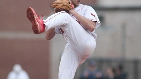 East Islip's Anthony Visconte throws a pitch in