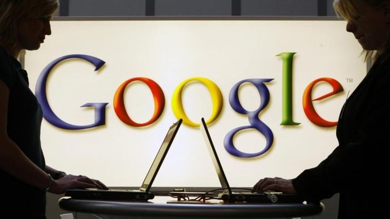 Exhibitors of the Google company work on laptop