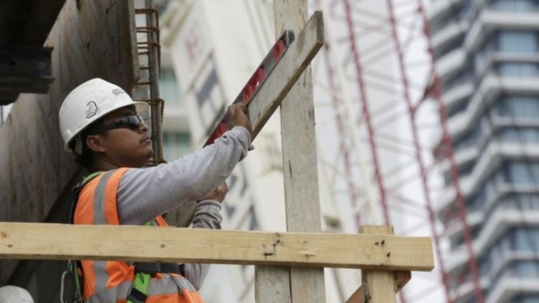 A construction worker works on the site of