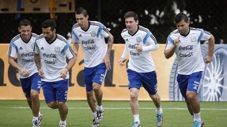 Argentine soccer players, from left, Maxi Rodriguez, Ezequiel