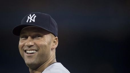 The Yankees' Derek Jeter laughs before a game