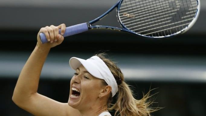 Maria Sharapova reacts after she played a return