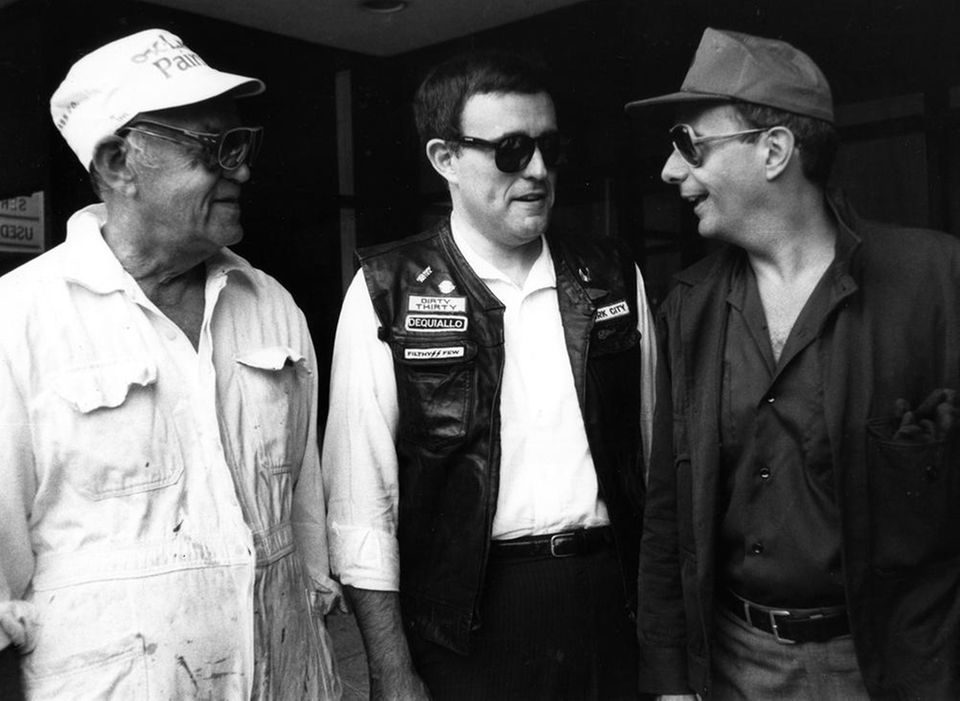Rudolph Giuliani, left,  and then-Sen. Alfonse D'Amato pose in undercover clothes in this July 9, 1986,  photo after D'Amato bought drugs on a New York City street. Giuliani was U.S. attorney at the time. (Credit: AP / Richard Drew)