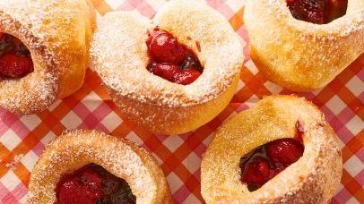 The popovers with mixed berry sauce can be