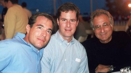 Bernard Madoff, right, is seen in a 2001
