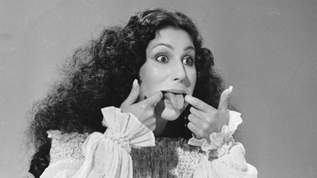 Entertainer Cher sticks her tongue out during taping