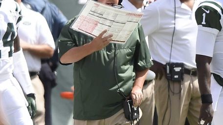 Jets offensive coordinator Marty Mornhinweg looks on during
