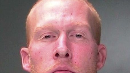 Frank Redd, 32, of Bohemia, is accused of