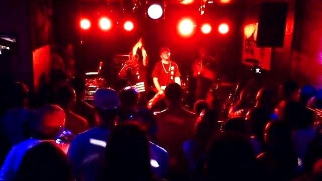 Two aspiring MCs performing as part of the