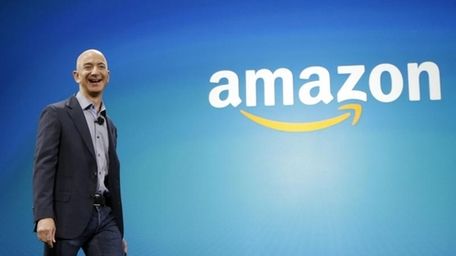Amazon CEO Jeff Bezos walks on stage for