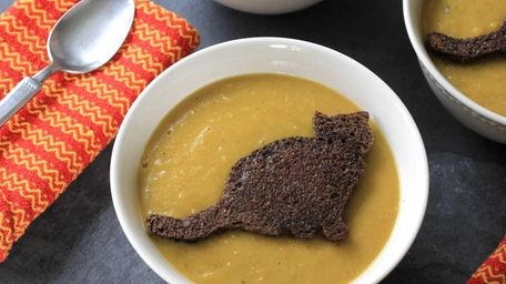 Simple yellow split pea soup garnished with a