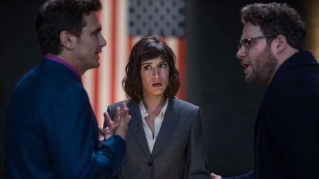 Lacey (Lizzy Caplan) with Dave (James Franco) and