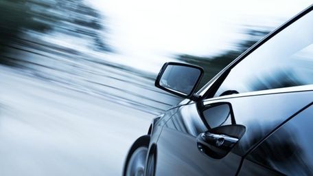 Car driving along a road.