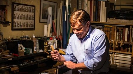 Book binder and restorer Paul Belard in the