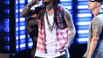 Chris Brown and Wisin perform at the 15th