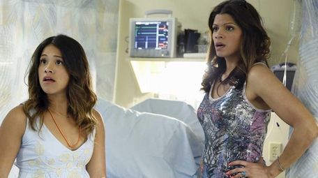 Gina Rodriguez, left, as Jane and Andrea Navedo