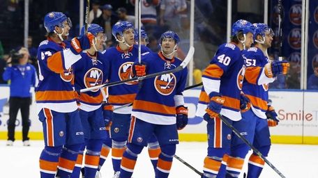 Lubomir Visnovsky of the New York Islanders salutes