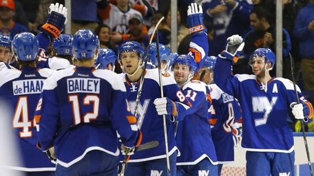 The New York Islanders celebrates after defeating the