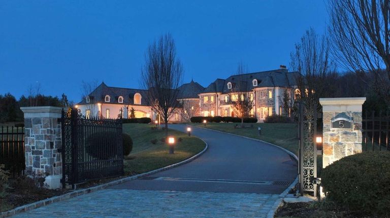 The sweeping entrance to the French chateau-style home