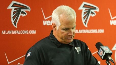 Atlanta Falcons head coach Mike Smith speaks at