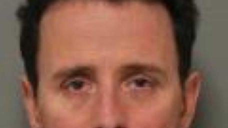Mark E. Palmer, 49, of Glen Cove, was