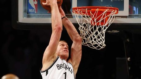 Mason Plumlee of the Brooklyn Nets goes to