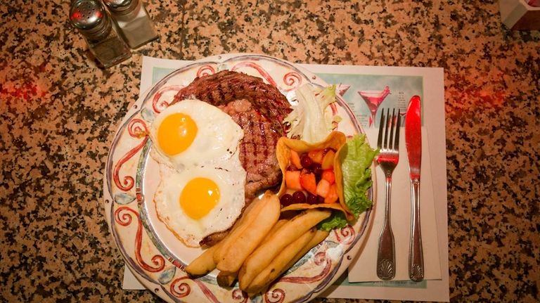 Ribeye steak and eggs is served at the